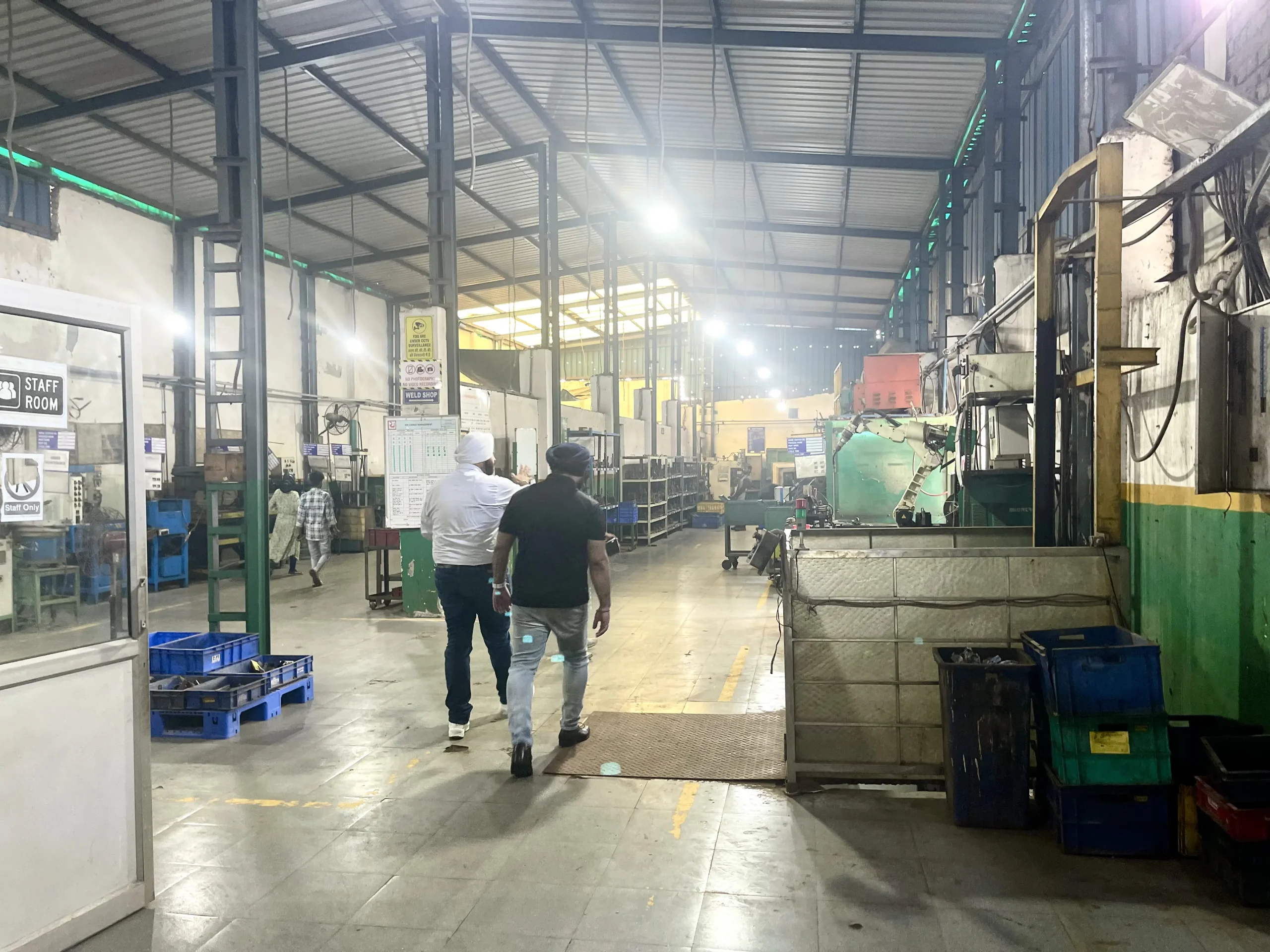Founder walkthrough on the stamping press floor during a facility visit at our India partner plant
