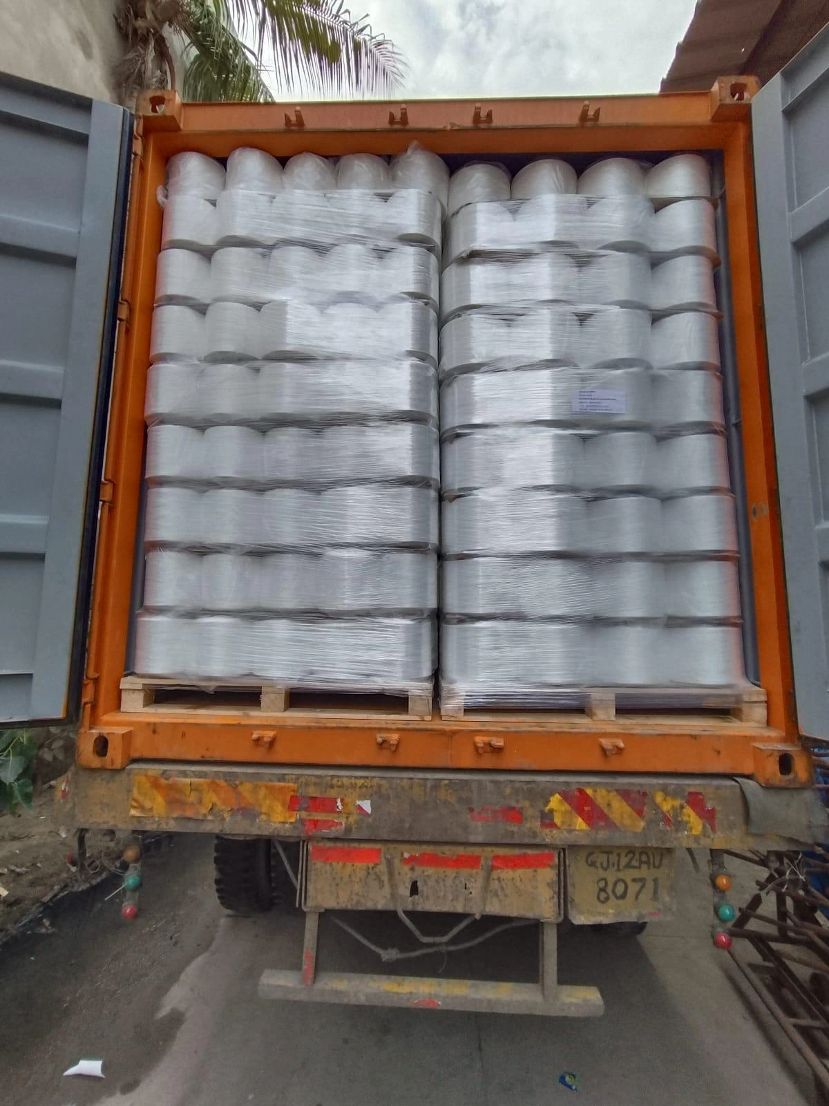 Loaded export container of finished parts leaving an Indian factory for the US dock