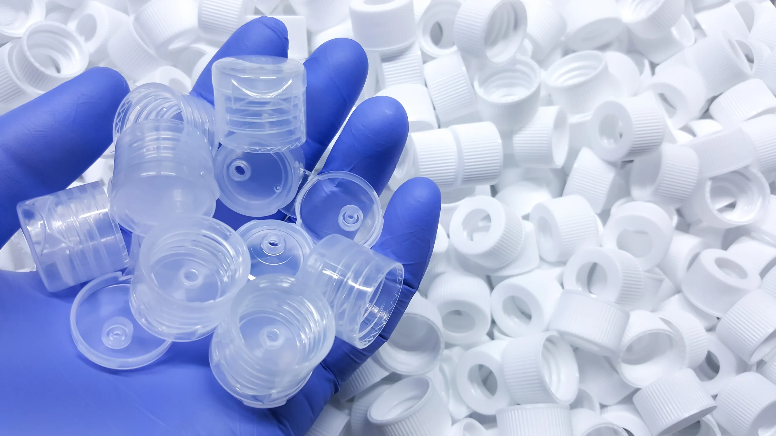 Injection molded caps and closures at our India partner facility, trimmed and ready for assembly
