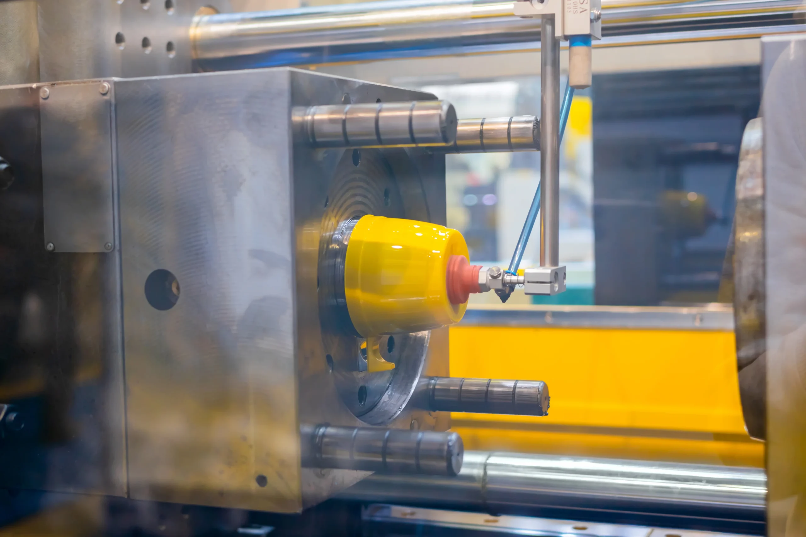 Injection molding machine running on the floor at our India partner facility