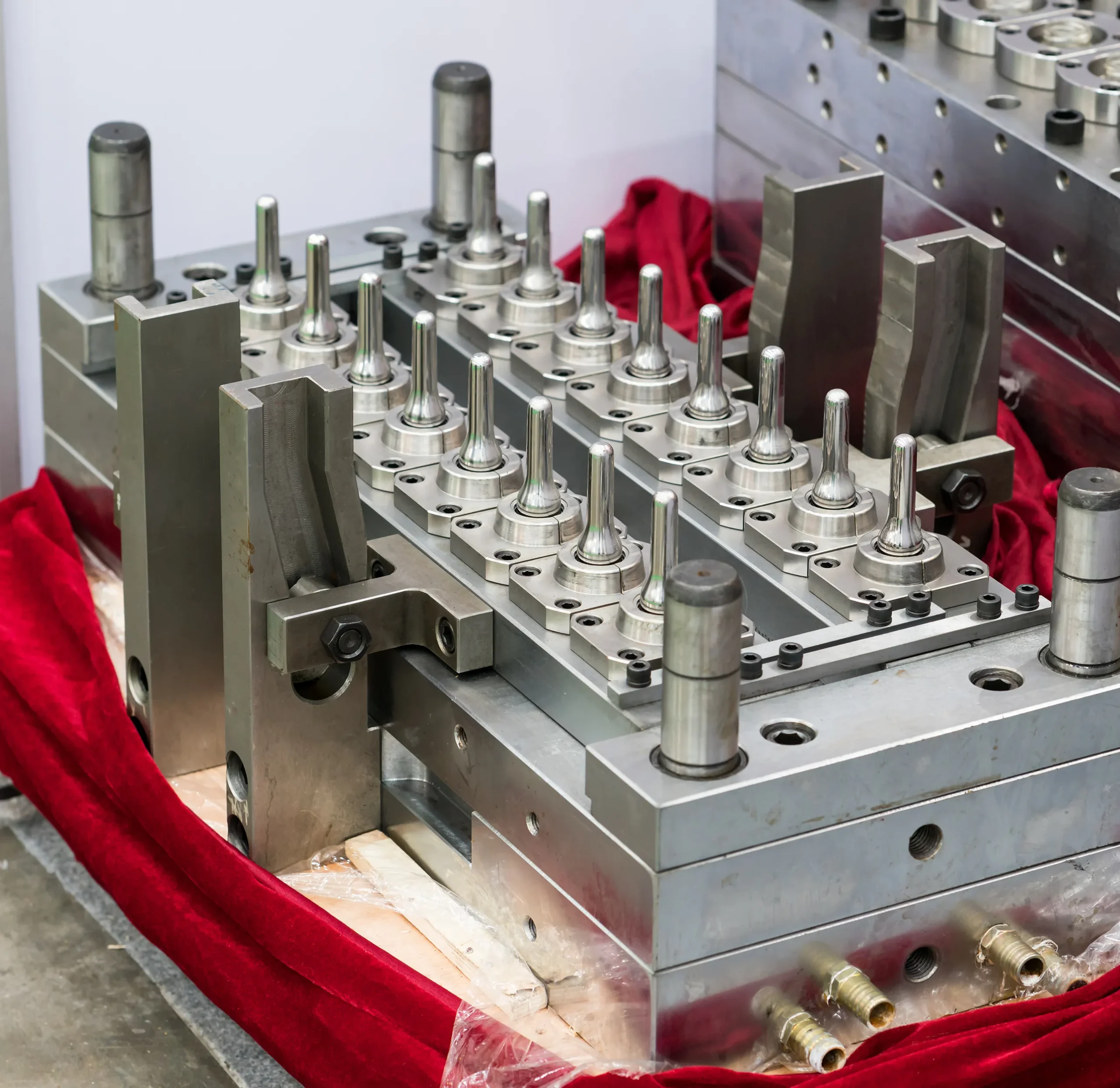 Injection molding machine and mold closed on the clamp at our India partner facility before the first PO