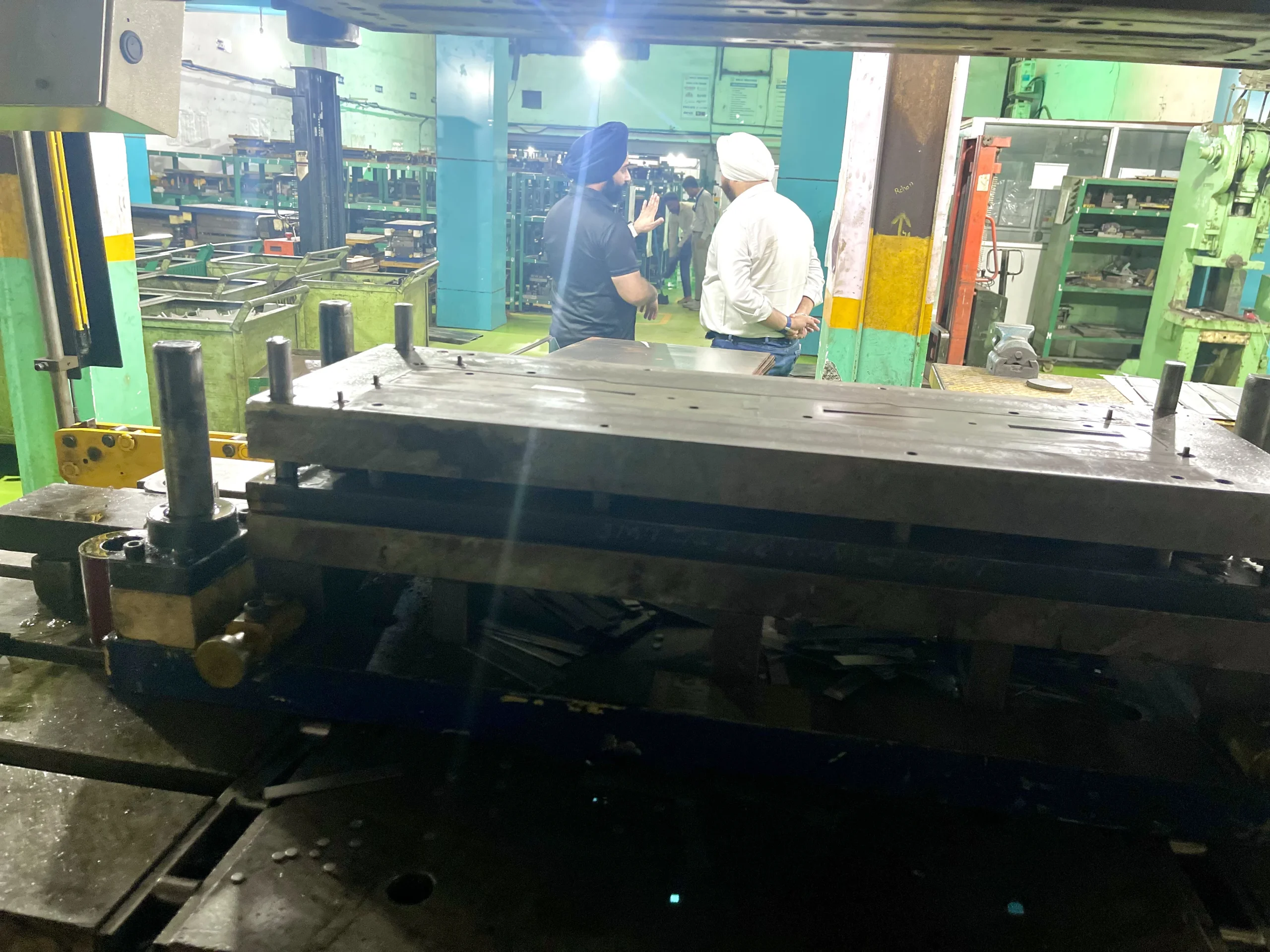 Wide view of the stamping floor at our India partner facility, presses and material handling under one roof