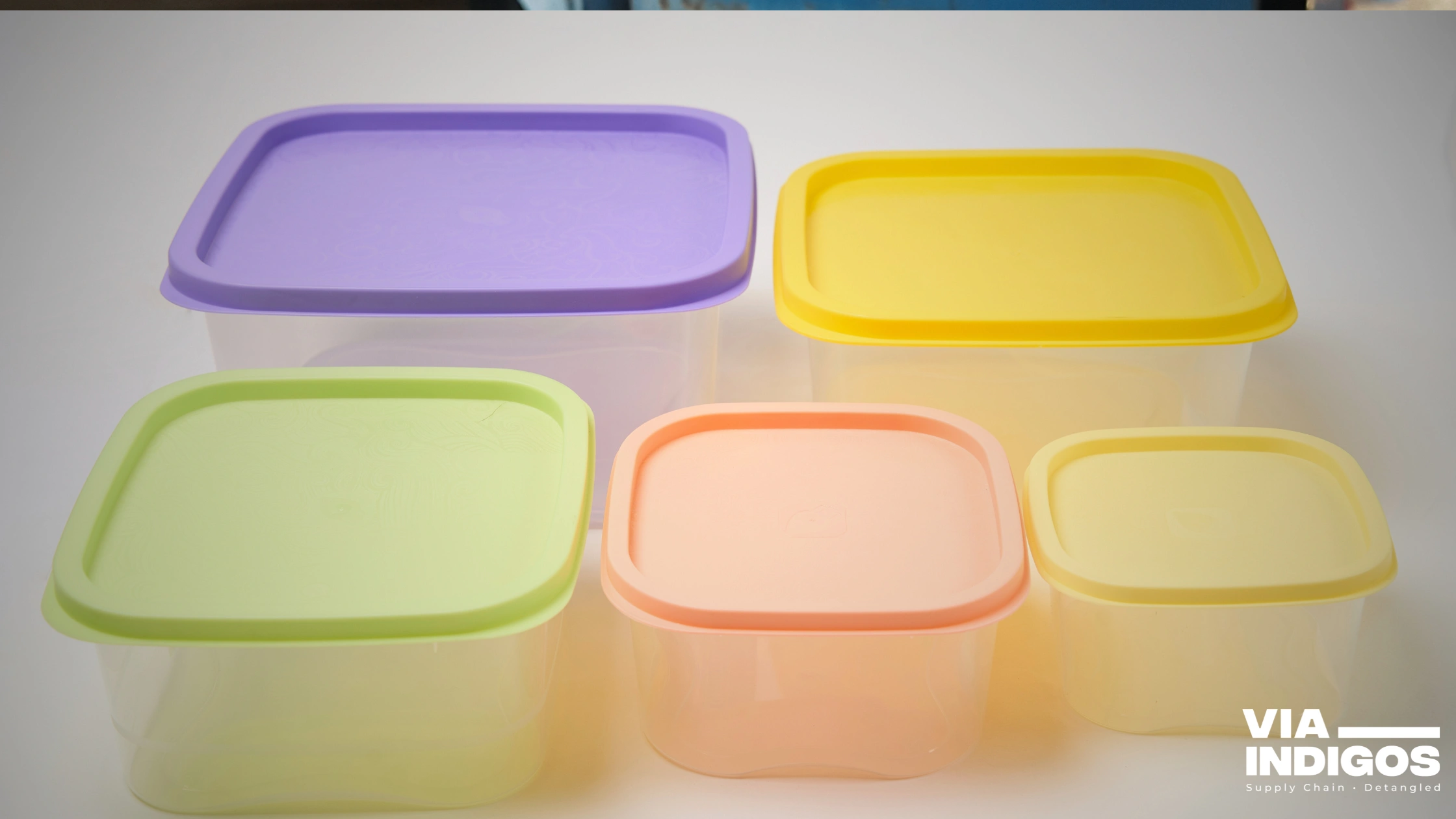 Colorful injection molded lids during assembly at our India partner facility
