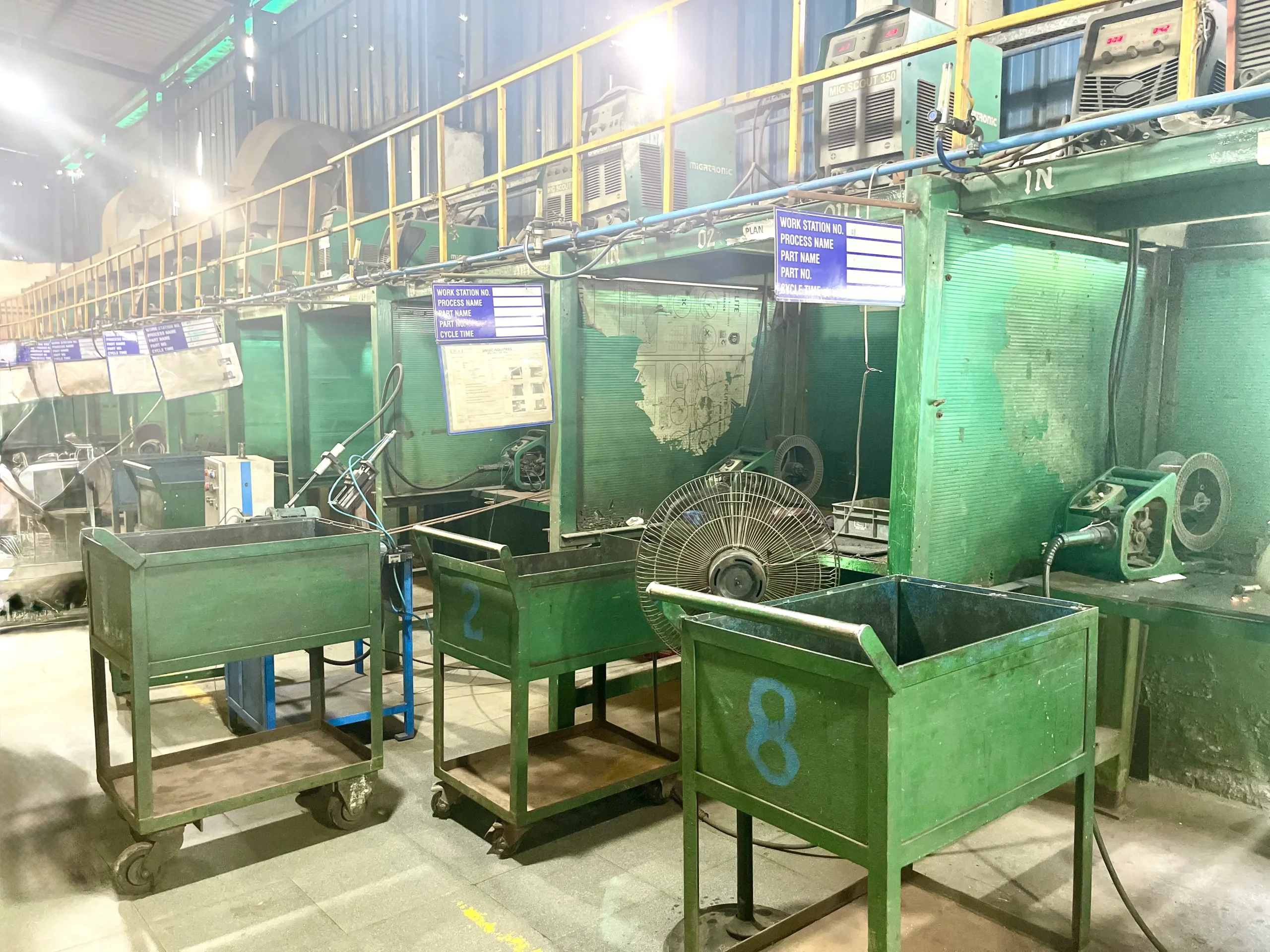 Robotic welding cells running fabricated steel assemblies at our India partner facility