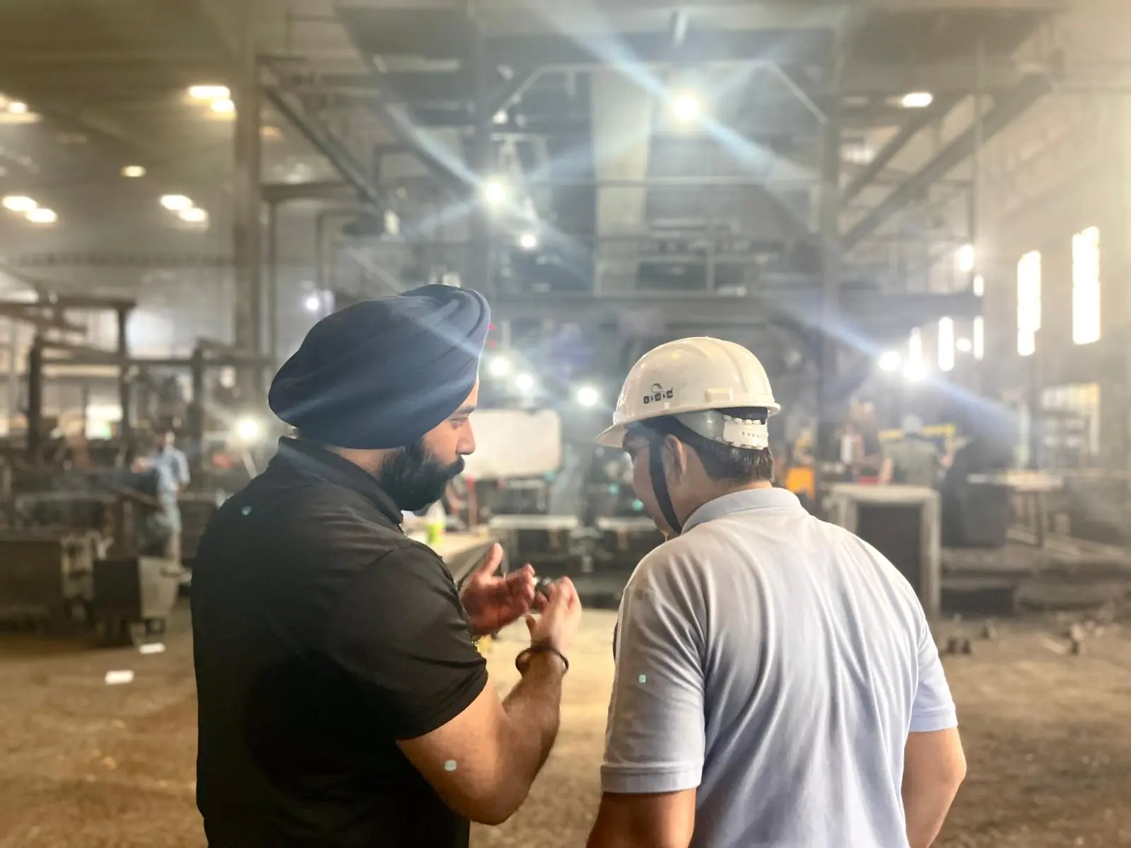 VIA INDIGOS founder talking with a casting supplier on the factory floor in India