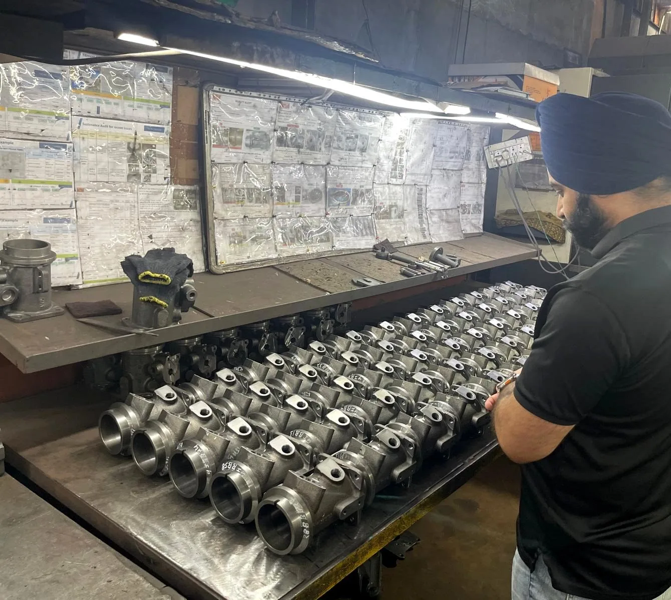 Mandeep Singh of VIA INDIGOS inspecting finished castings on the floor of a partner facility in India
