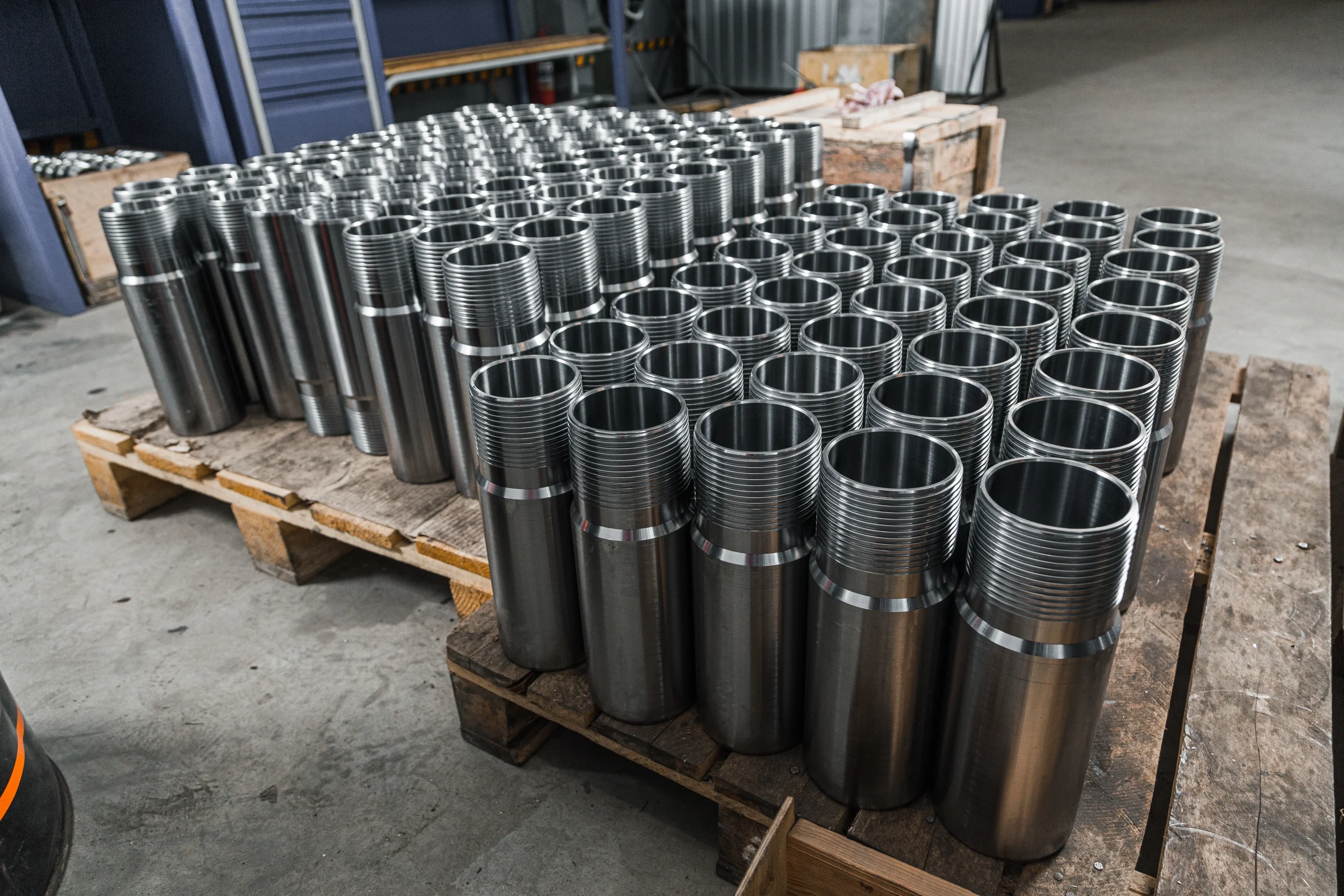 First article fabricated steel brackets laid out for inspection, angled and top views, at our India partner facility