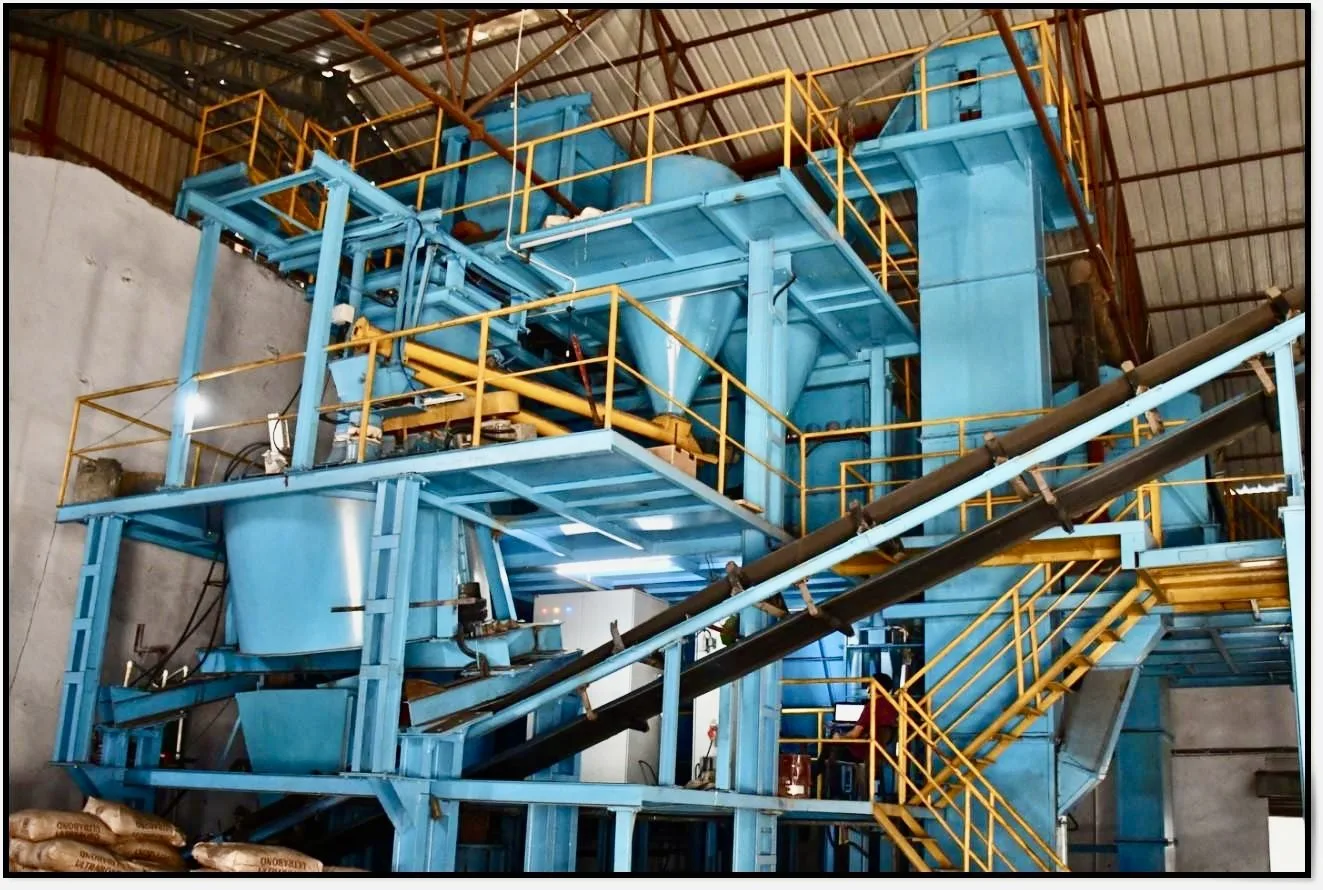 Sand reclamation and processing plant inside a VIA INDIGOS casting partner foundry in India, used to recover and recondition green sand between mould cycles