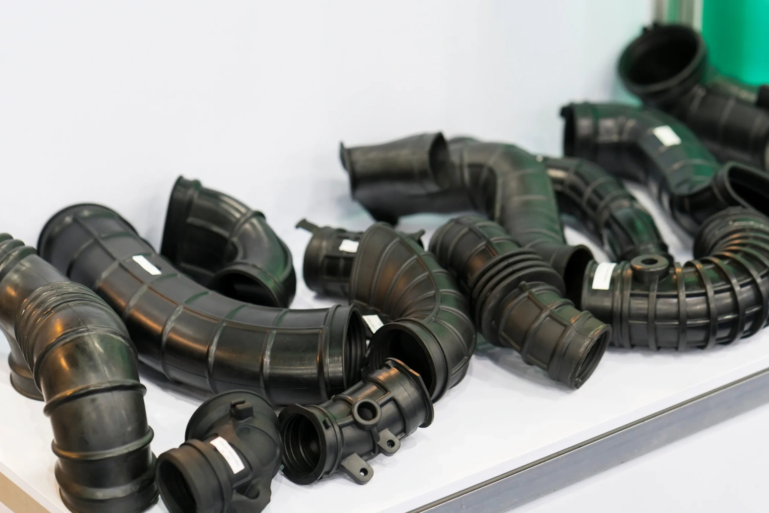 Molded rubber air intake bellows with corrugated flex sections for automotive engines at our India partner facility