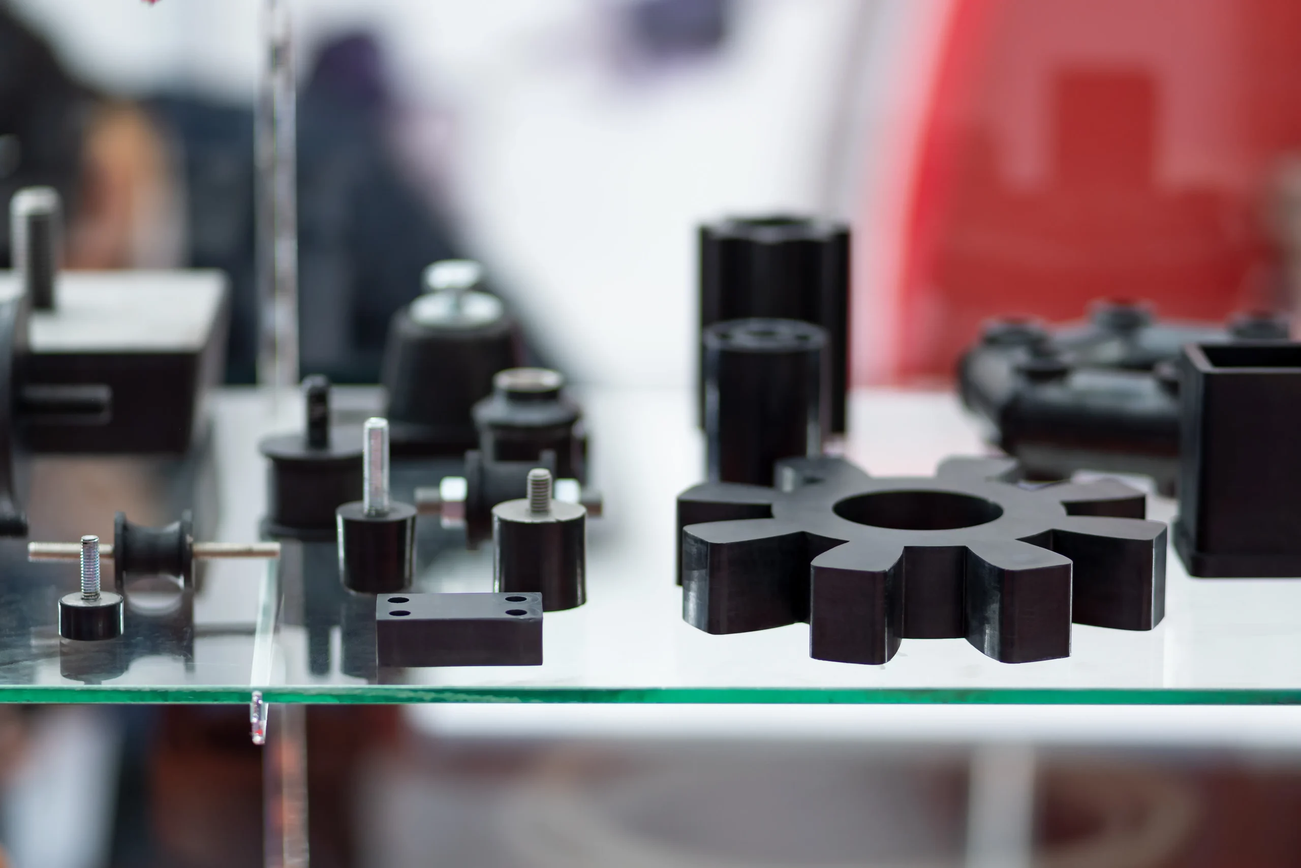 Molded rubber vibration mounts and a coupling insert on the floor at our India partner facility