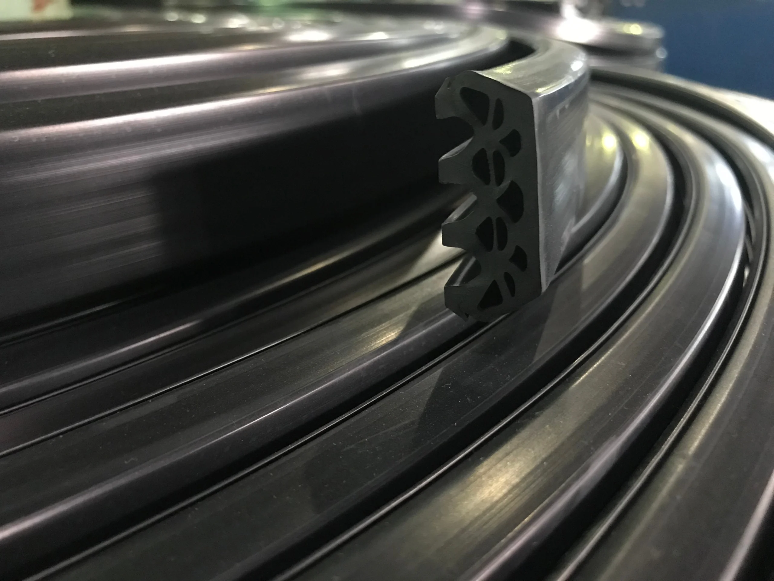 Coiled extruded rubber profile on a reel at our India partner facility after the production run, batch volume in order