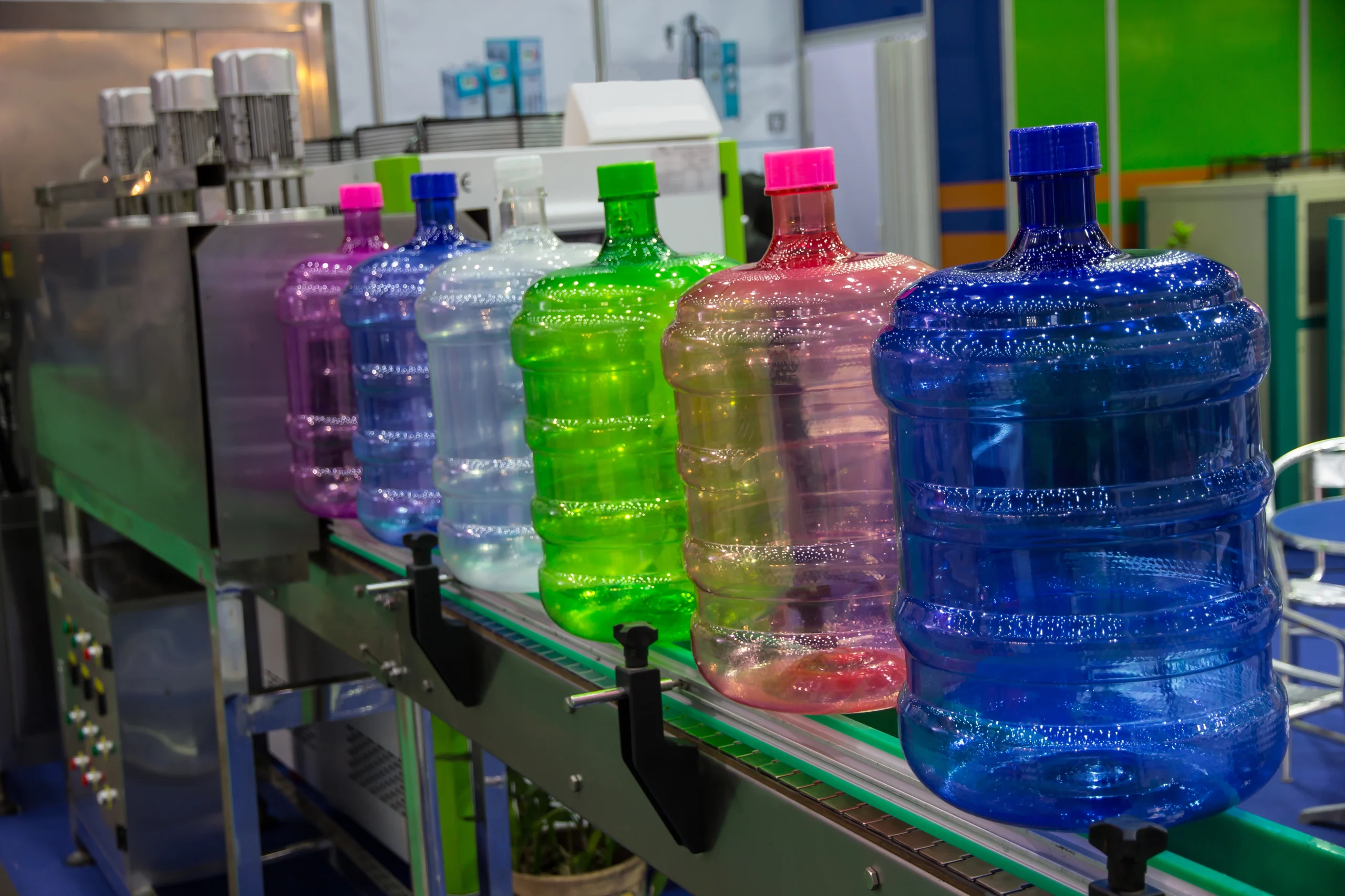 Colorful blow molded bottles after assembly at our India partner facility, ready to pack