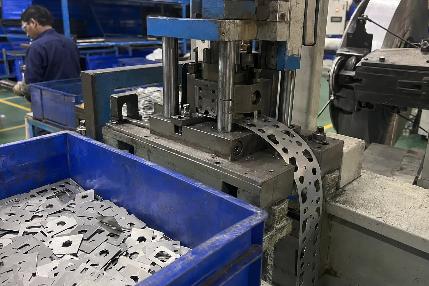 Caliper alignment shims being stamped from thin sheet metal in India