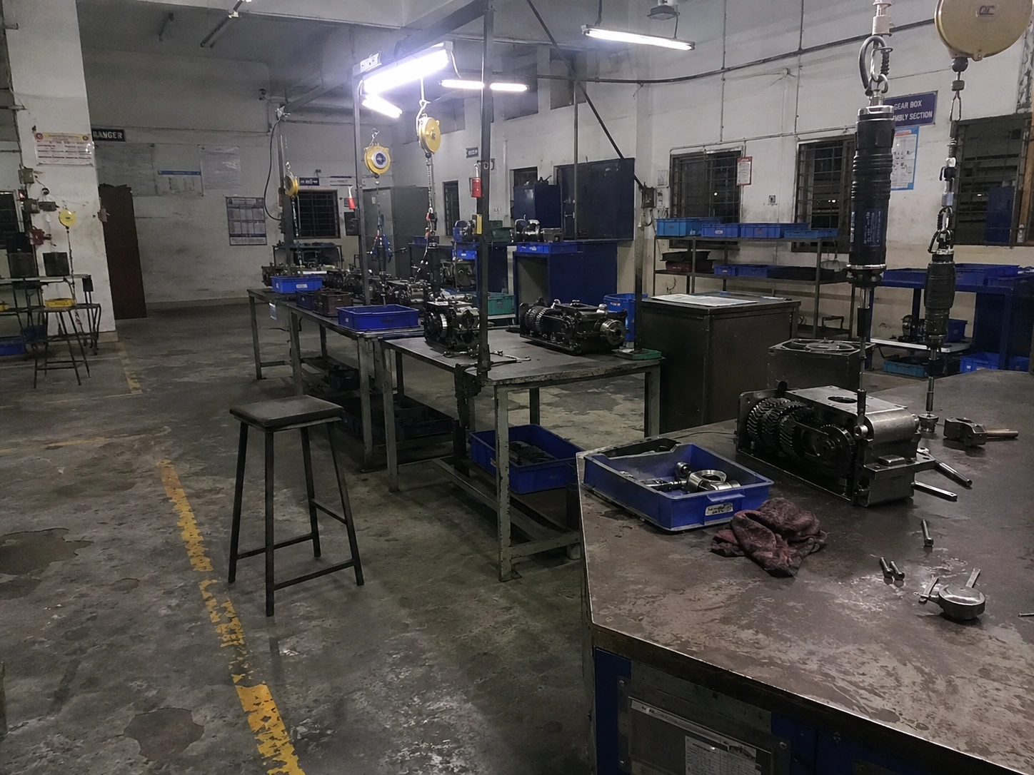 Assembly benches with hanging torque tools and part trays after the shift at our India partner facility